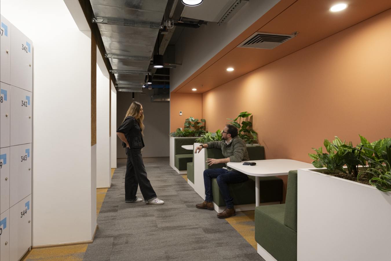 Emapta Offices - Semi-private acoustic booths with warm wood paneling for focused work - Contract Workplaces.jpg